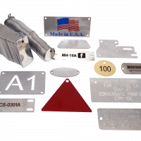 Assorted Metal Tags That Are Stamped, Engraved, and Embossed