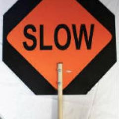 Orange and Black Traffic Sign That Says 